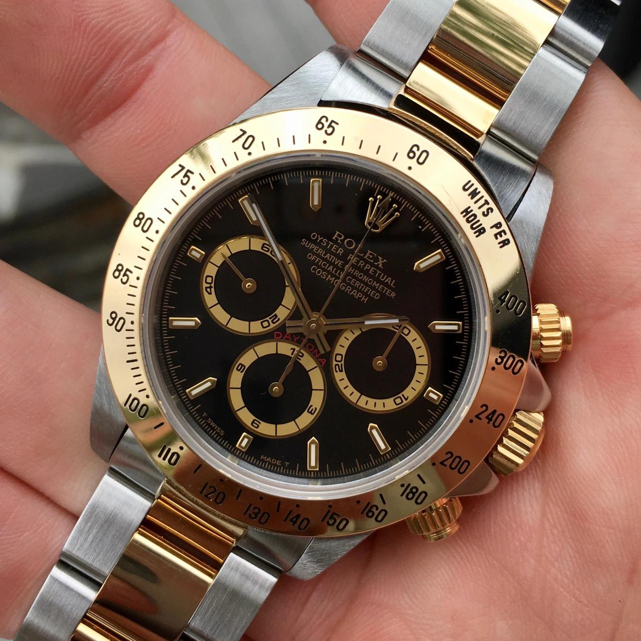 Rolex daytona black and gold